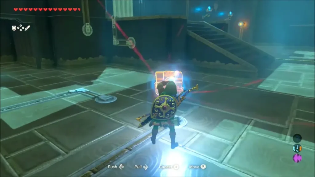 Link moving a chest with Magnesis along the shrine floor circuit Link moving a chest with Magnesis along the shrine floor circuit