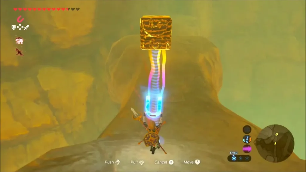 Link lifting a golden metal block with Magnesis in the canyon Link lifting a golden metal block with Magnesis in the canyon