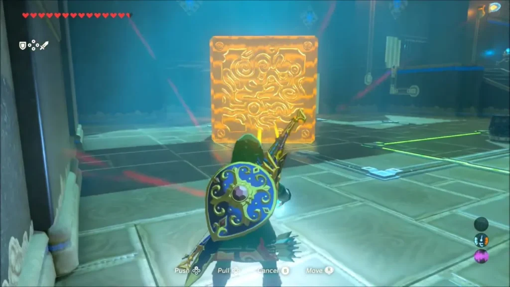 Link using Magnesis to hold a large metal block in the shrine Link using Magnesis to hold a large metal block in the shrine