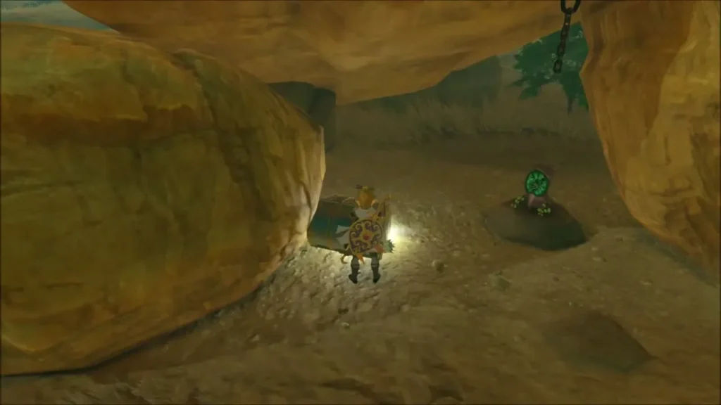 Link moving a rock with Magnesis under the overhang, Korok beside him Link moving a rock with Magnesis under the overhang, Korok beside him