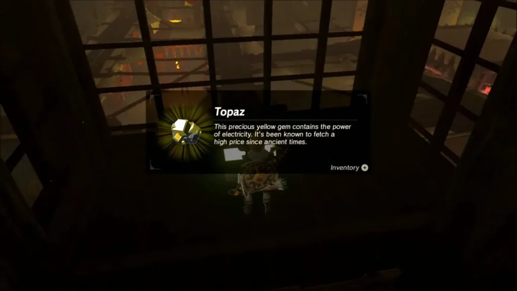 Link picking up a Topaz from a chest on a high hideout ledge Link picking up a Topaz from a chest on a high hideout ledge