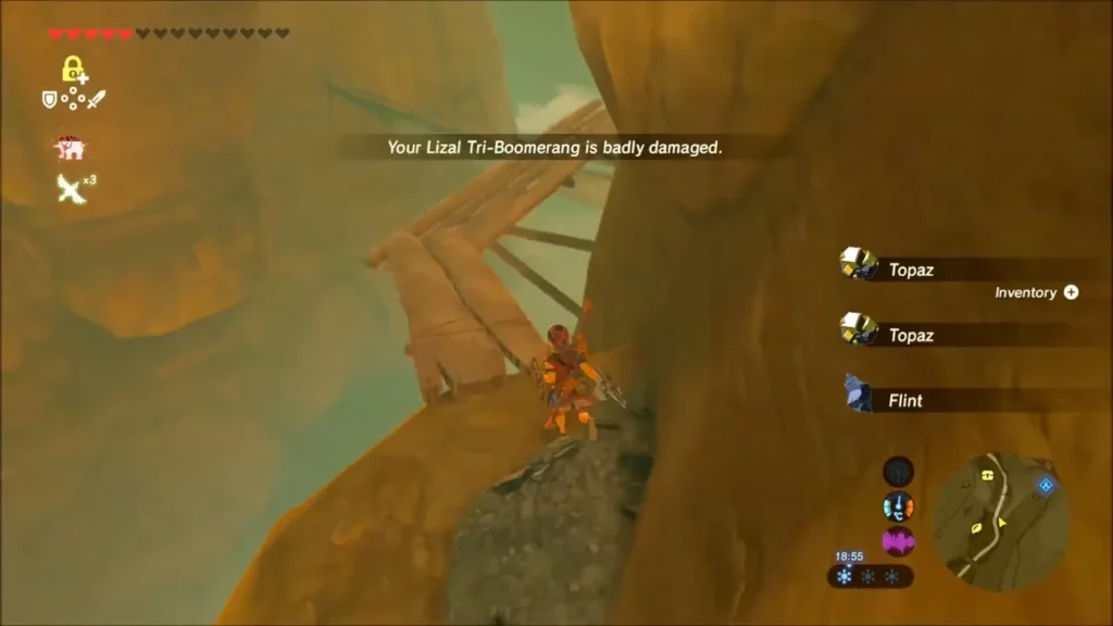 Link on a cliff ledge below wooden planks, picking up topaz and flint Link on a cliff ledge below wooden planks, picking up topaz and flint