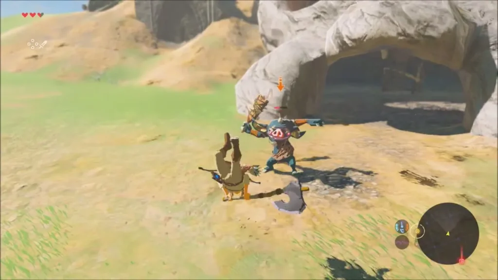 Link fighting a blue Bokoblin outside the cave Link fighting a blue Bokoblin outside the cave