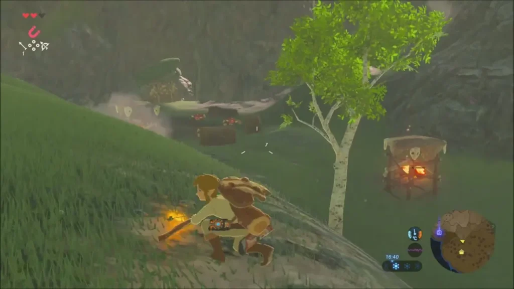 Link crouching with a torch to light the Bokoblin camp Link crouching with a torch to light the Bokoblin camp