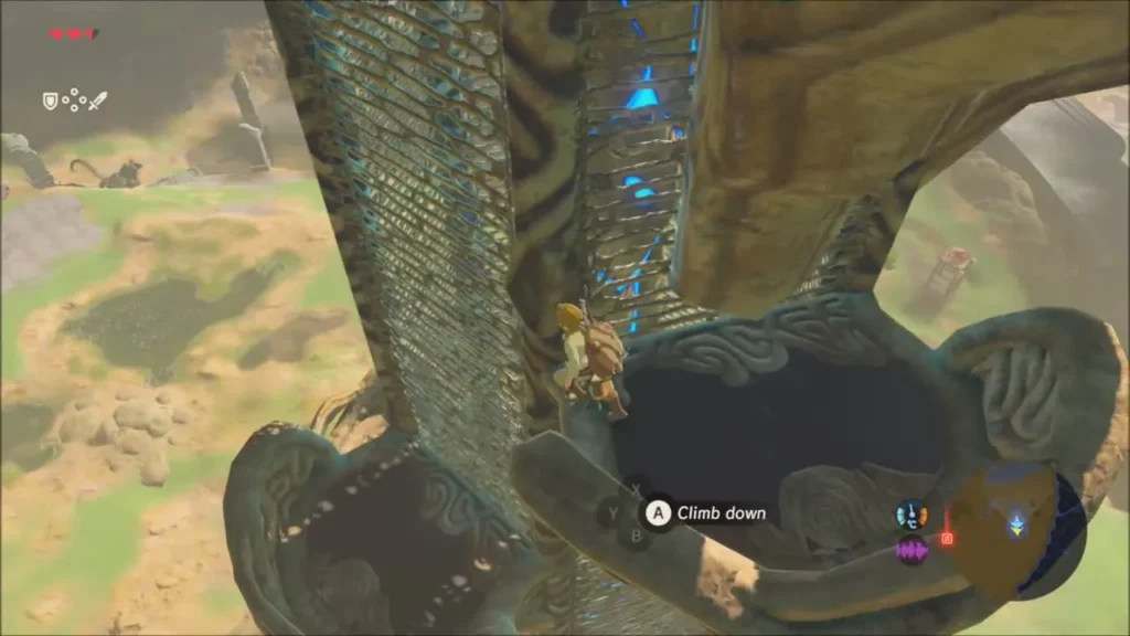 Link about to climb down the Great Plateau Tower with a Climb down prompt Link about to climb down the Great Plateau Tower with a Climb down prompt
