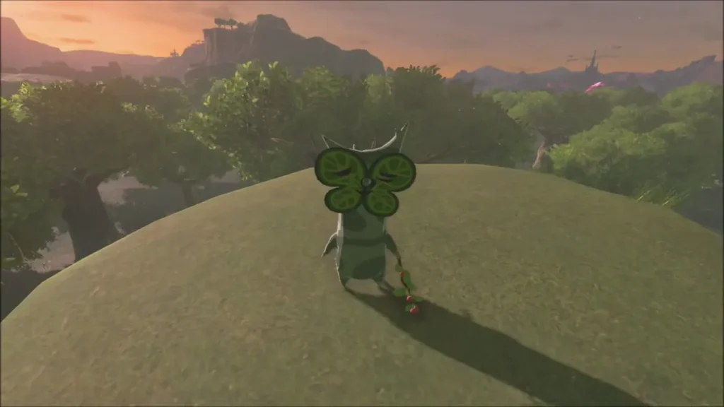 A Korok standing on the grassy hilltop at sunset A Korok standing on the grassy hilltop at sunset
