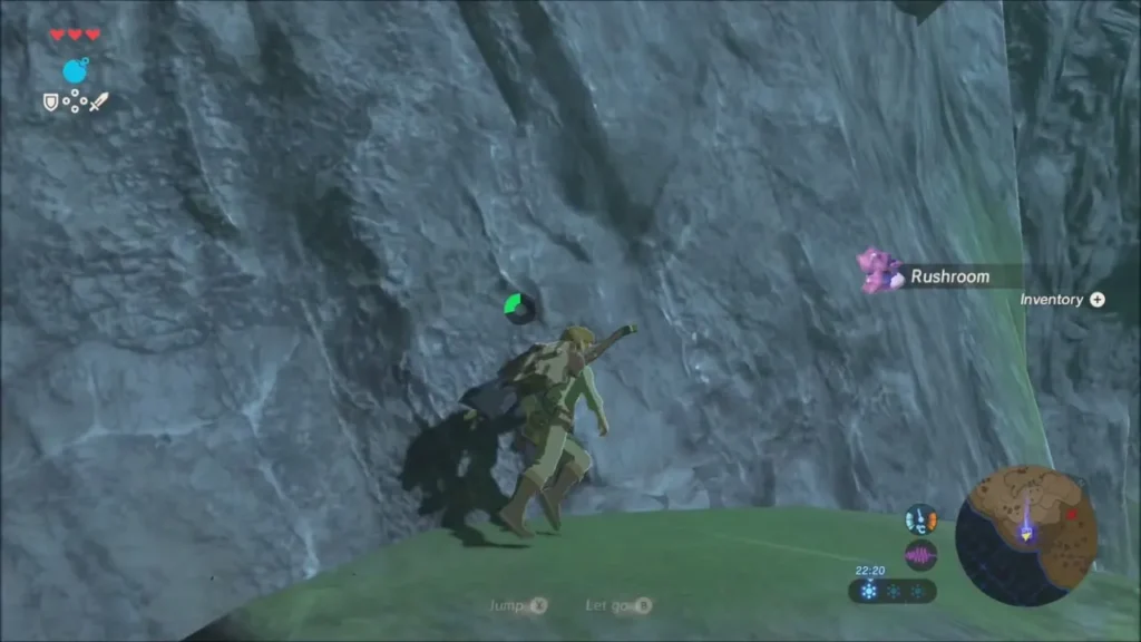 Link resting on a grassy ledge partway up the cliff Link resting on a grassy ledge partway up the cliff
