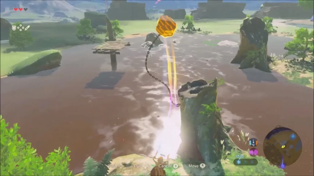 Link lifting a metal object from the stream with Magnesis beside the chained stump Link lifting a metal object from the stream with Magnesis beside the chained stump