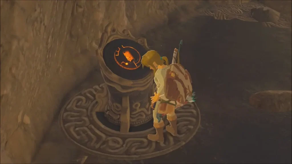 Link placing the Sheikah Slate on the glowing tower pedestal Link placing the Sheikah Slate on the glowing tower pedestal