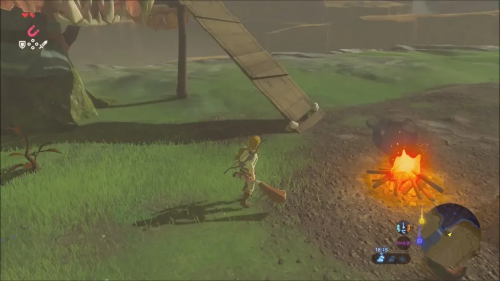 Link beside a campfire below the wooden ramp leading up to the platform Link beside a campfire below the wooden ramp leading up to the platform