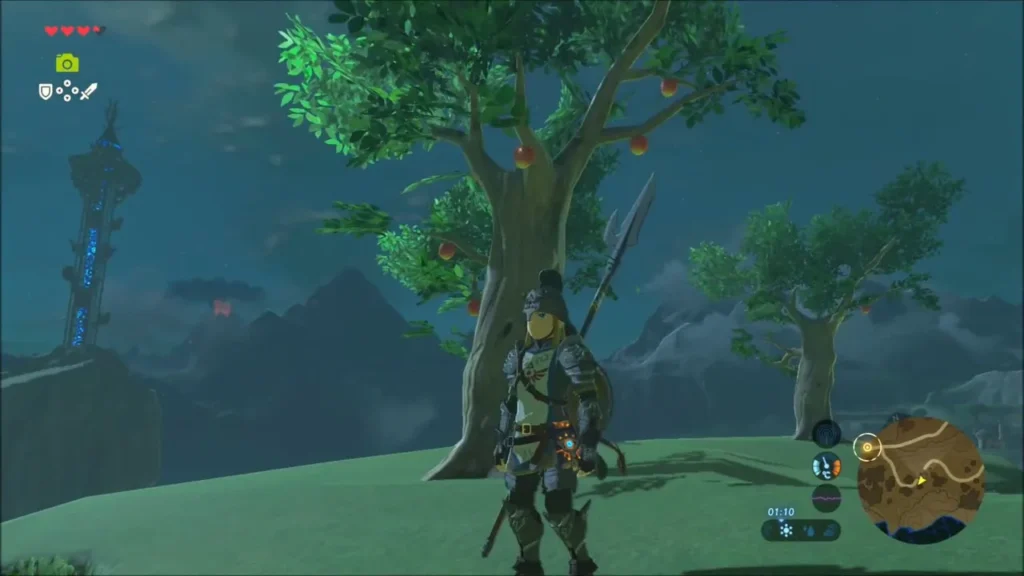 Link standing on a night hill beside apple trees heavy with fruit