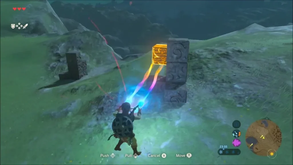 The orange block lined up on top of the dark metal blocks