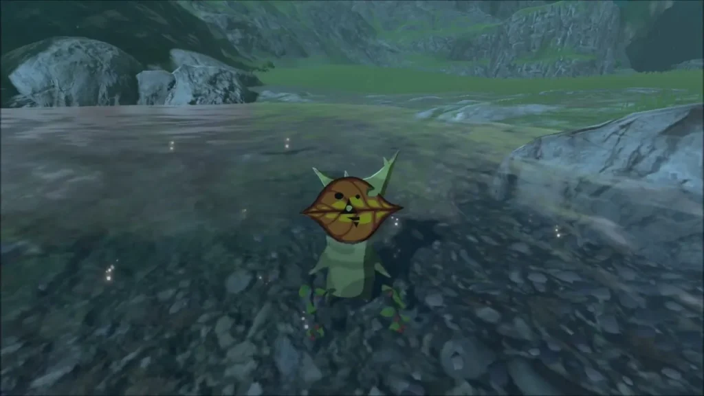 A Korok popping up from the gravel of the river bank