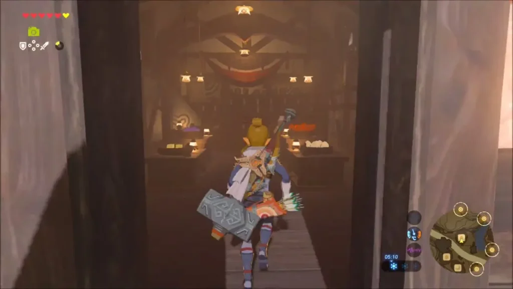Link running into a lantern-lit Kakariko shop