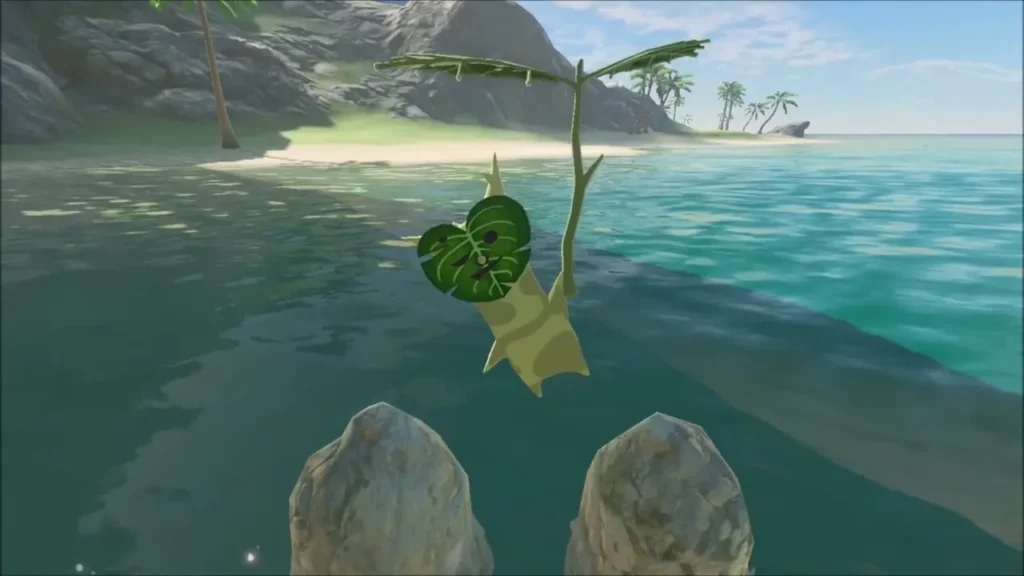 A Korok holding its leaf appears between two rocks in the shallows