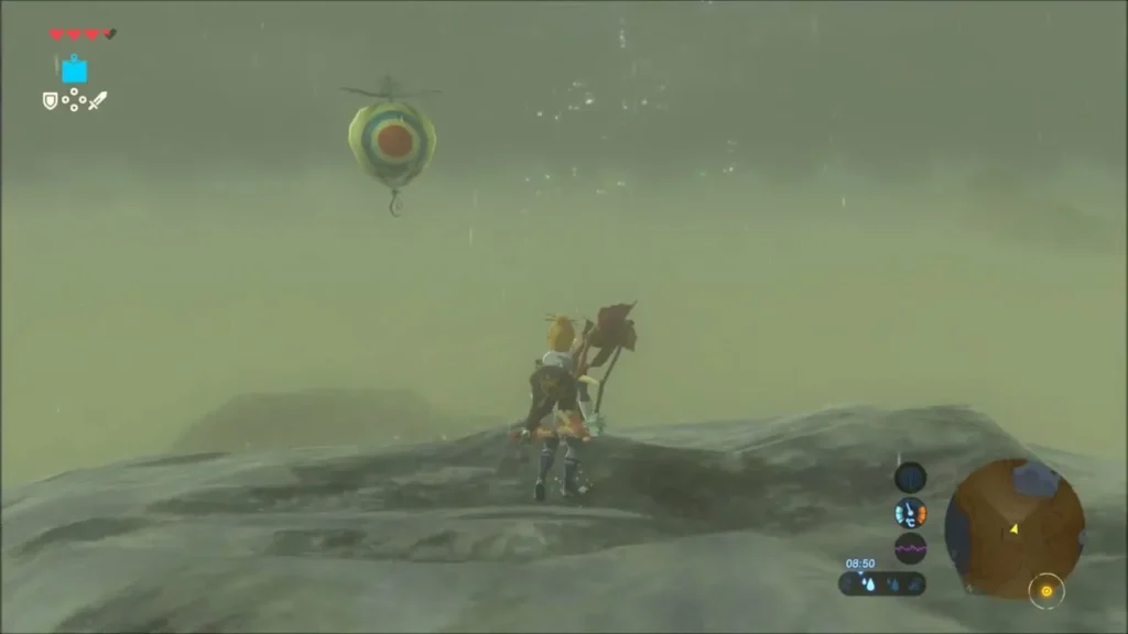 Link on the ridge top with a Korok balloon hovering overhead