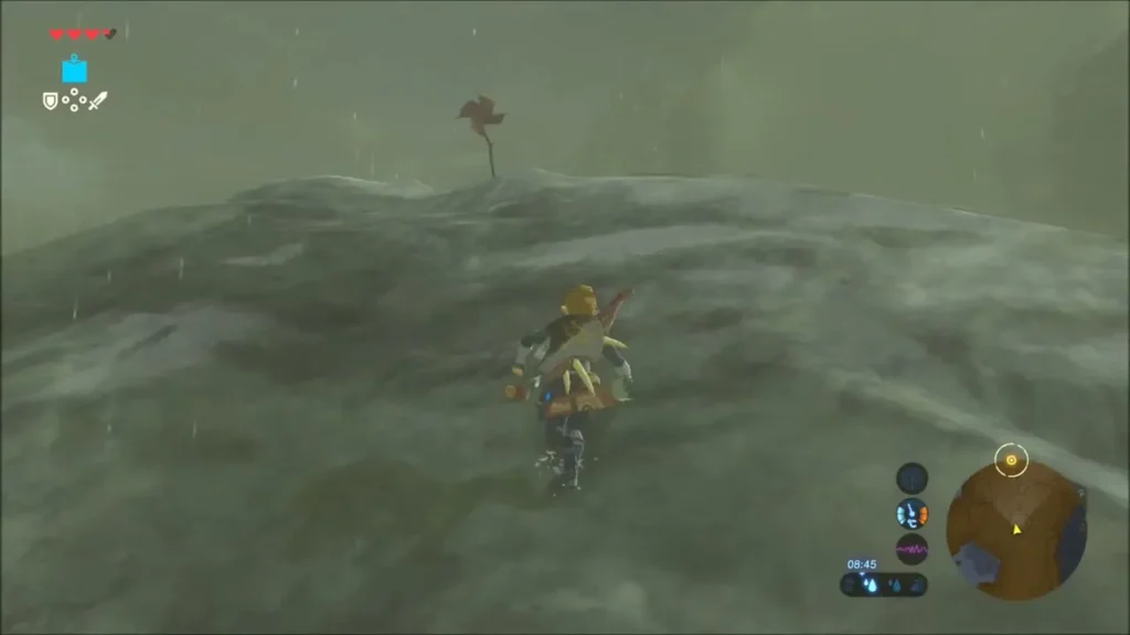 Link climbing the bare rocky ridge with a distant Korok pinwheel on the crest