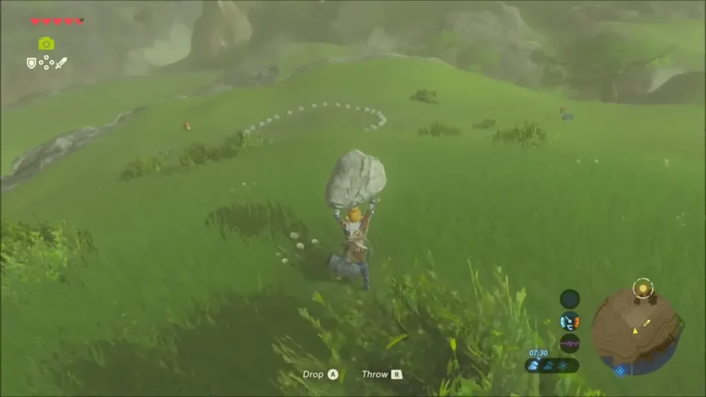 Link carrying a boulder across the hillside