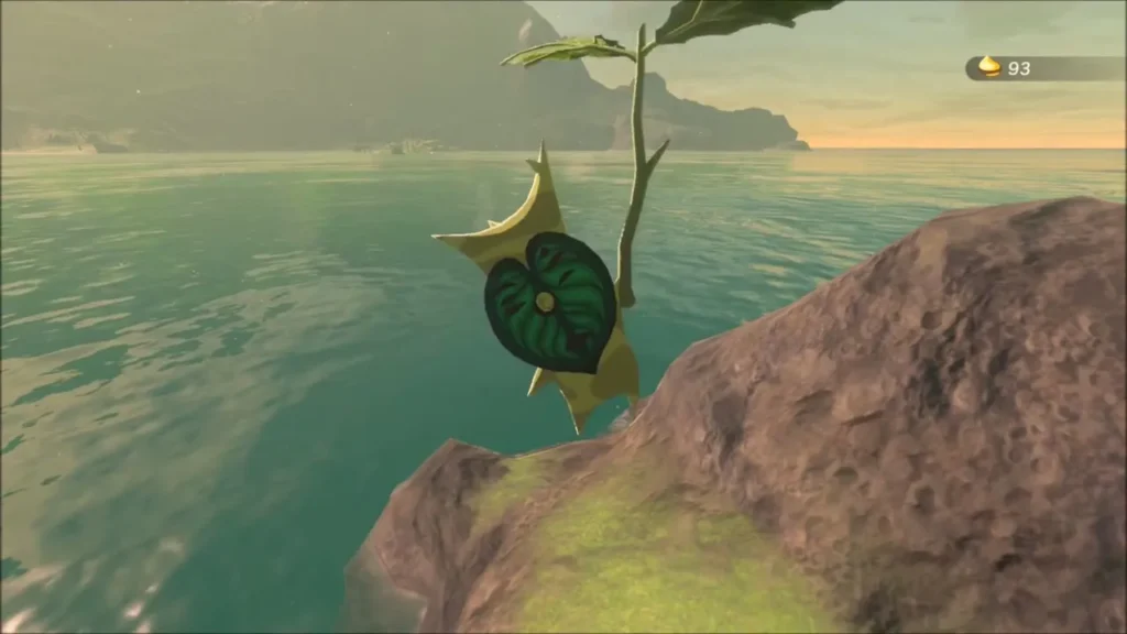 A Korok with its leaf mask on a rocky islet over the sea