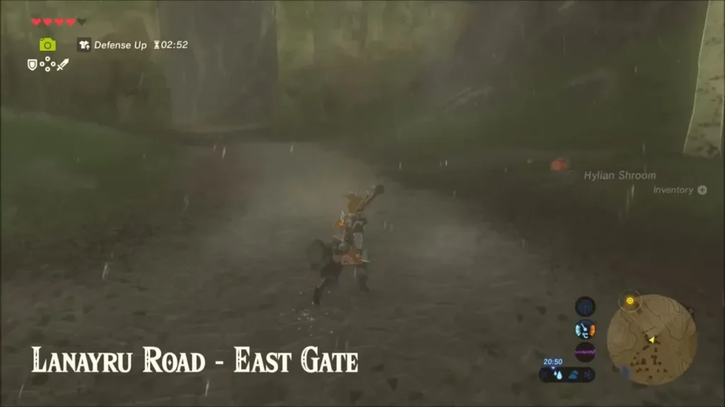 Link walking Lanayru Road in the rain as the East Gate title card appears