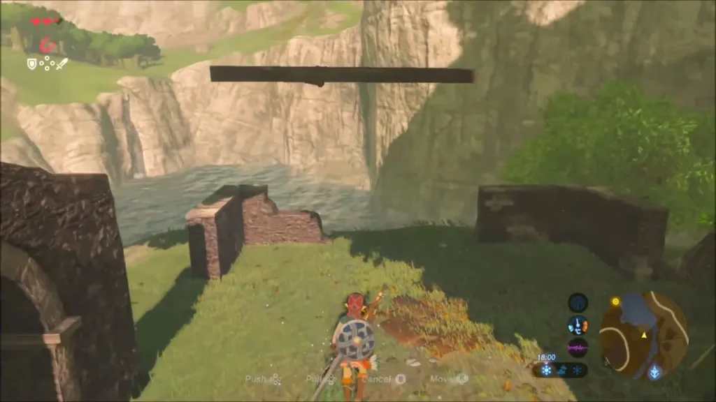 Metal beam lifted high above the lakeside ruins