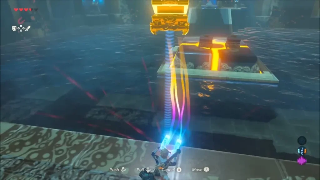 Link pulling a metal chest with Magnesis over the water room