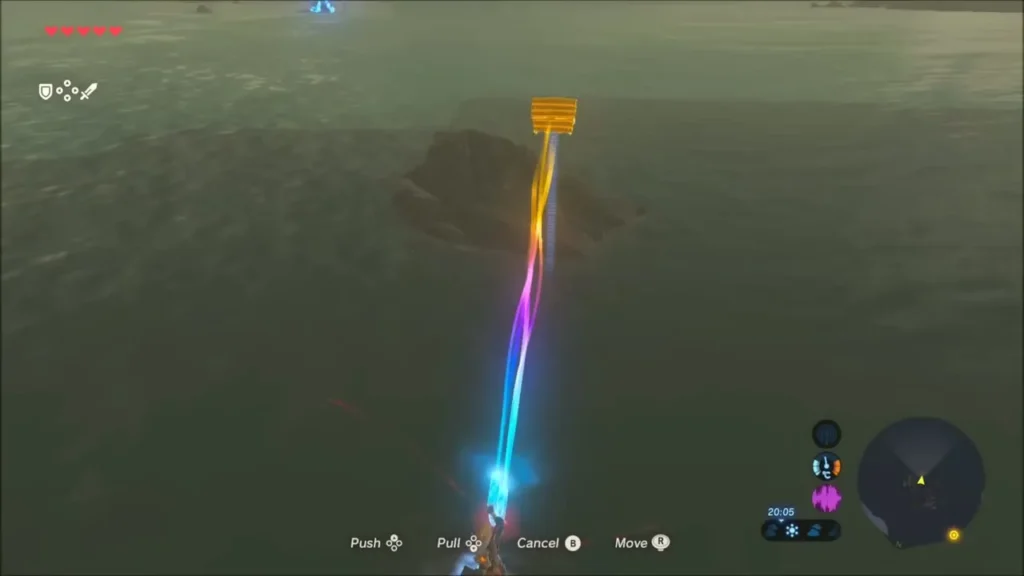 Magnesis pulling a golden chest up from the water near a rock pillar