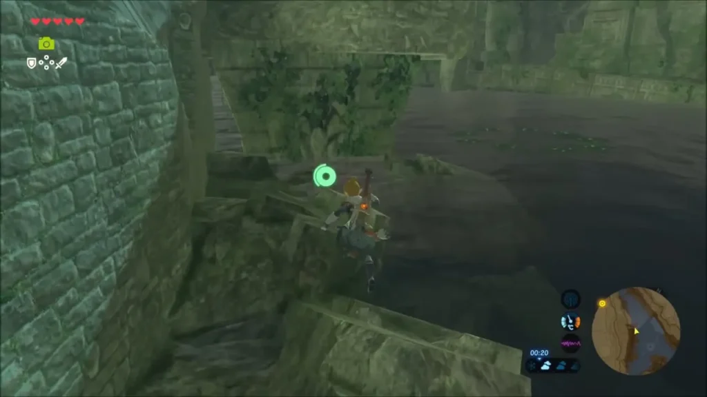 Link climbing along a mossy broken wall above dark water