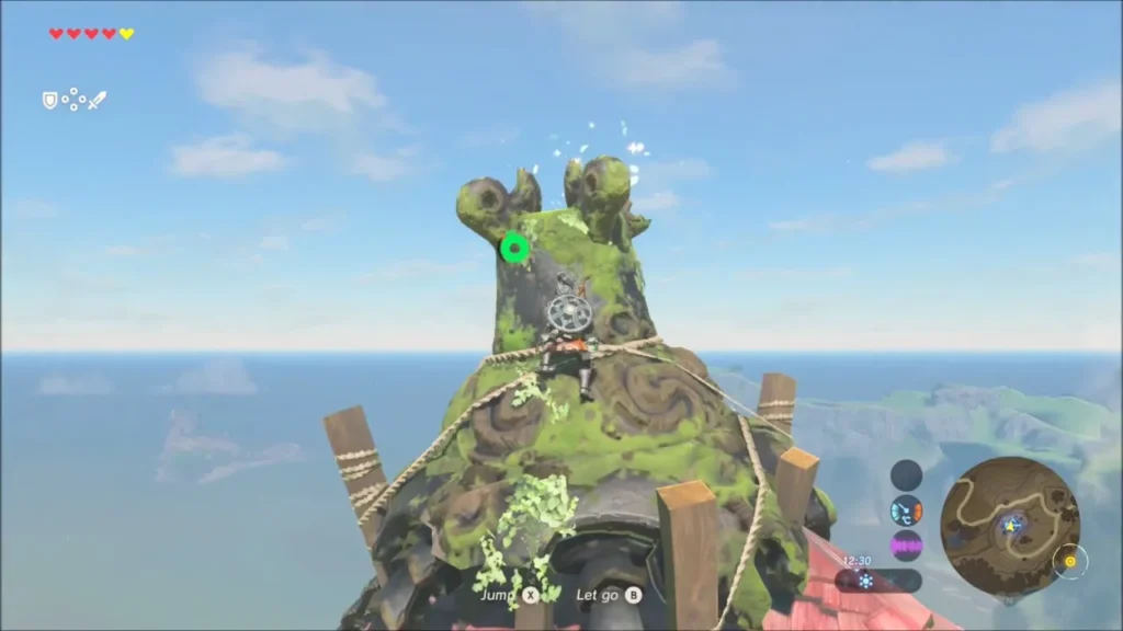 Link nearing the top of the mossy rock above the lab