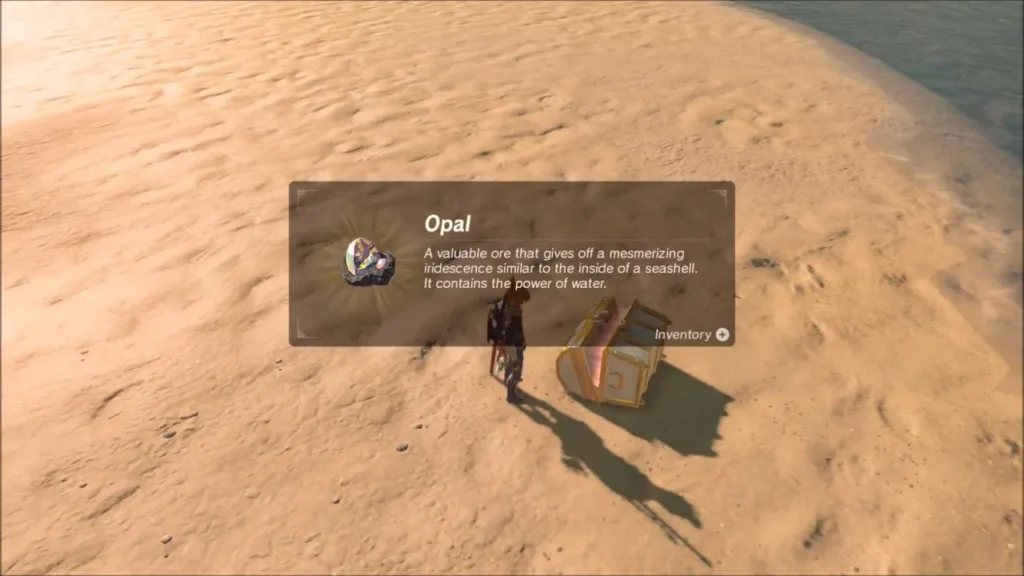 Link beside an open chest on the sand with the Opal item box