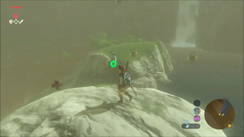 Link atop the white rock pillar with Korok-leaf seeds floating around the lagoon