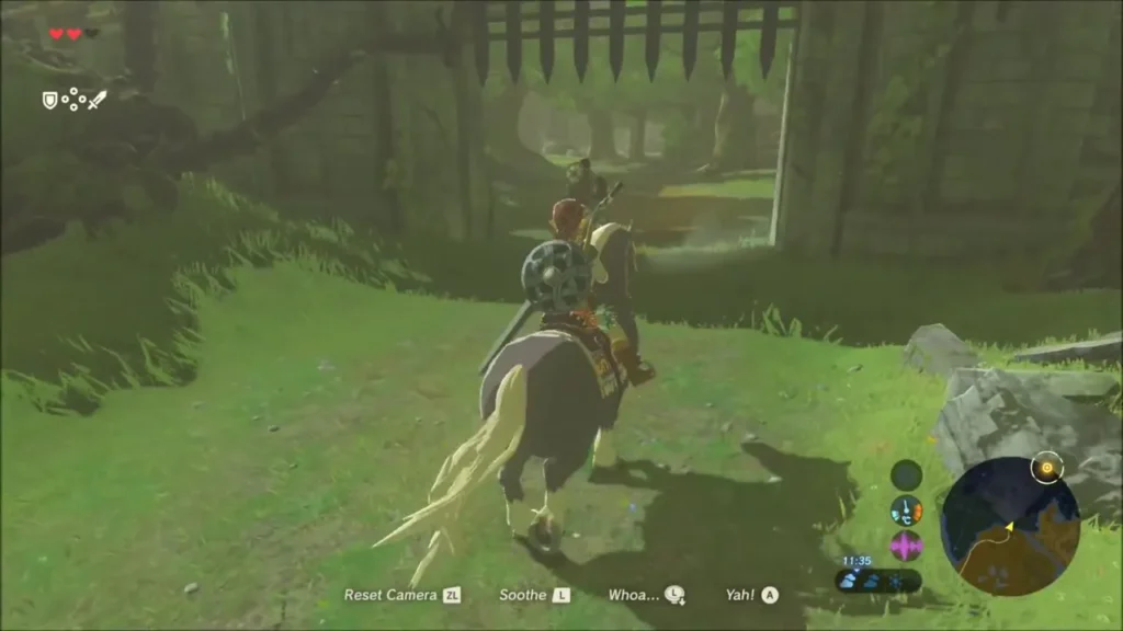 Link on horseback approaching the open portcullis of Fort Hateno