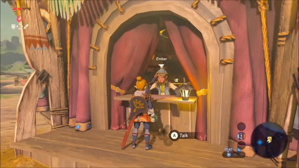 Link at the counter of Riverside Stable facing the stable keeper
