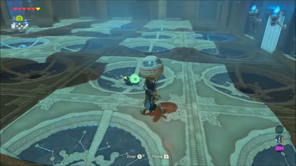 Link carrying a sphere across the shrine floor toward a hollow