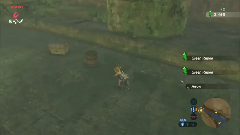 Chest and barrel on a ruined stone walkway with Green Rupees picked up nearby