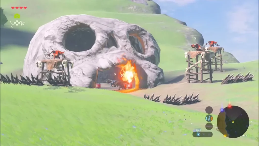 A fire arrow hits the mouth of the skull rock where Bokoblins wait