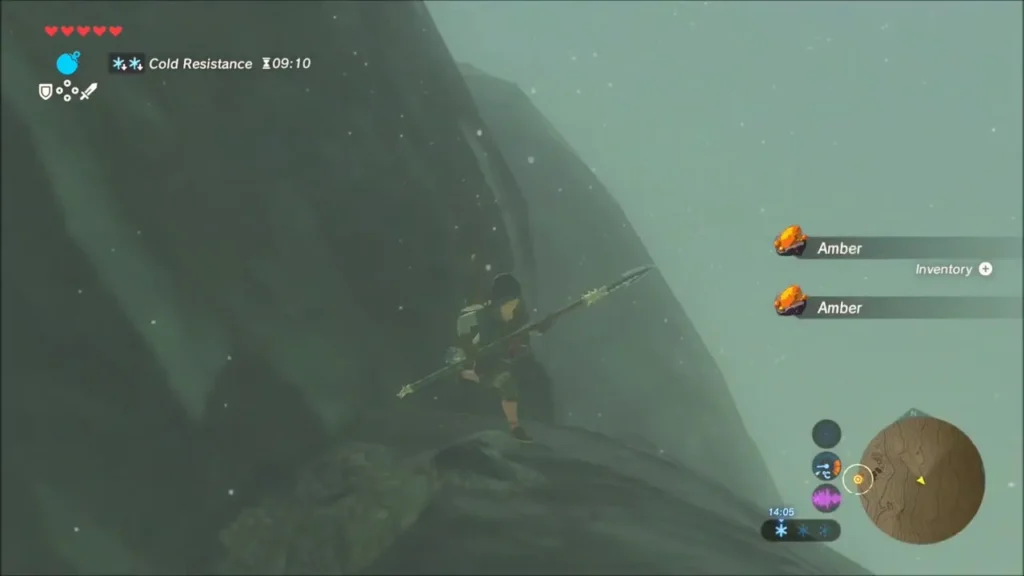 Link climbing a snowy cliff with the Cold Resistance timer running