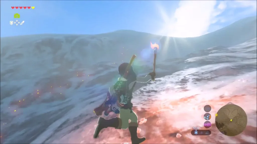 Link holding a torch up on a snowy mountain slope