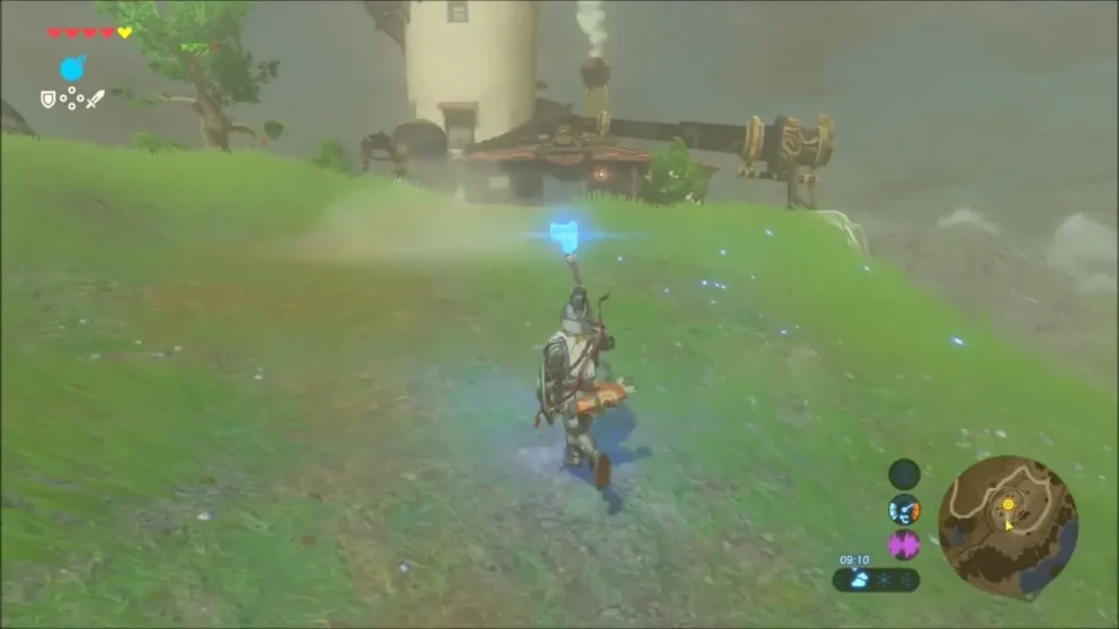 Link carrying the blue torch up the hill toward the lab