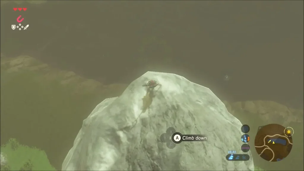 Link at the top of the white boulder, ready to climb down