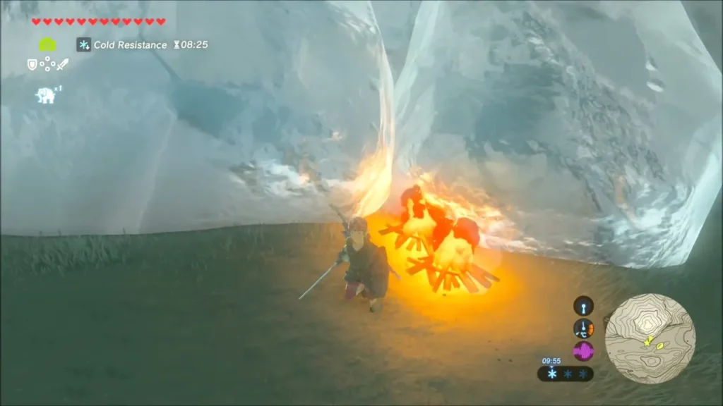 Link crouching at a campfire lit against a giant ice block Link crouching at a campfire lit against a giant ice block