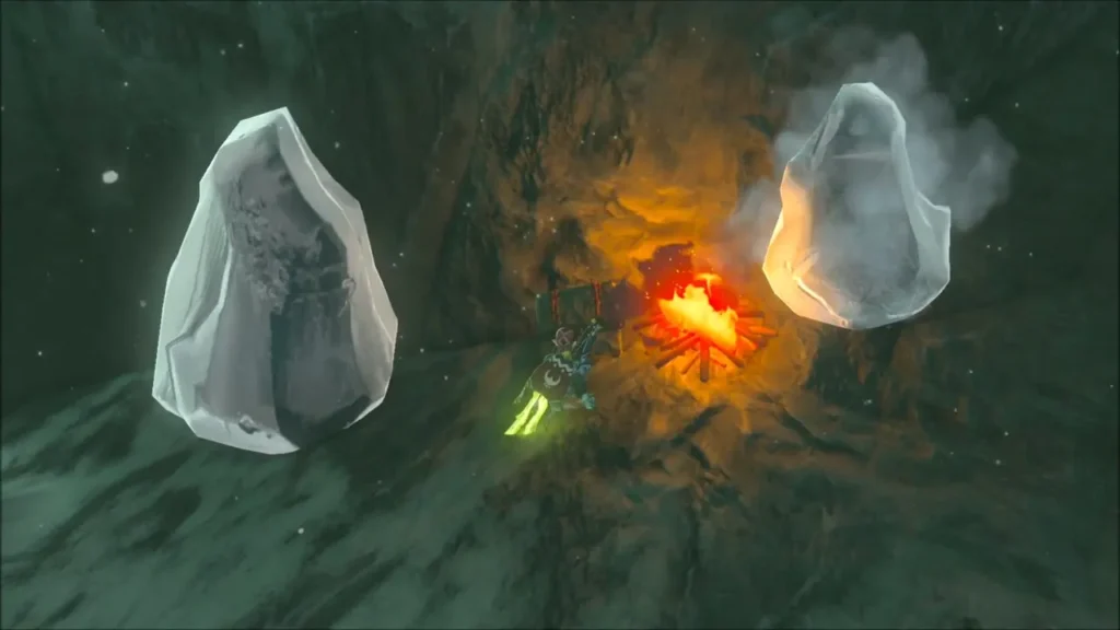 A campfire burning between two ice blocks in the ice cave A campfire burning between two ice blocks in the ice cave