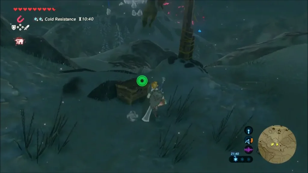 Link standing beside a wooden chest on a dark snowy slope Link standing beside a wooden chest on a dark snowy slope