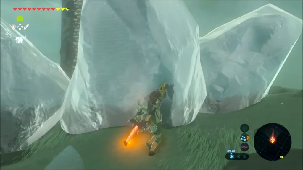 Link beside the big ice blocks crusting the base of Hebra Tower Link beside the big ice blocks crusting the base of Hebra Tower