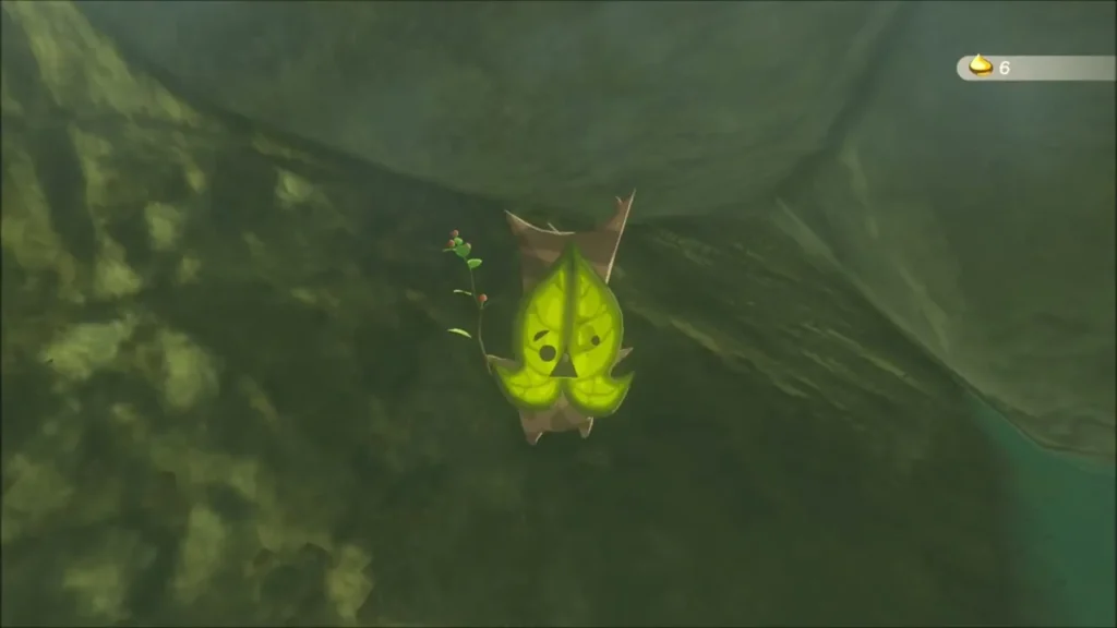 A Korok hanging from the cave ceiling above the hot spring pool A Korok hanging from the cave ceiling above the hot spring pool