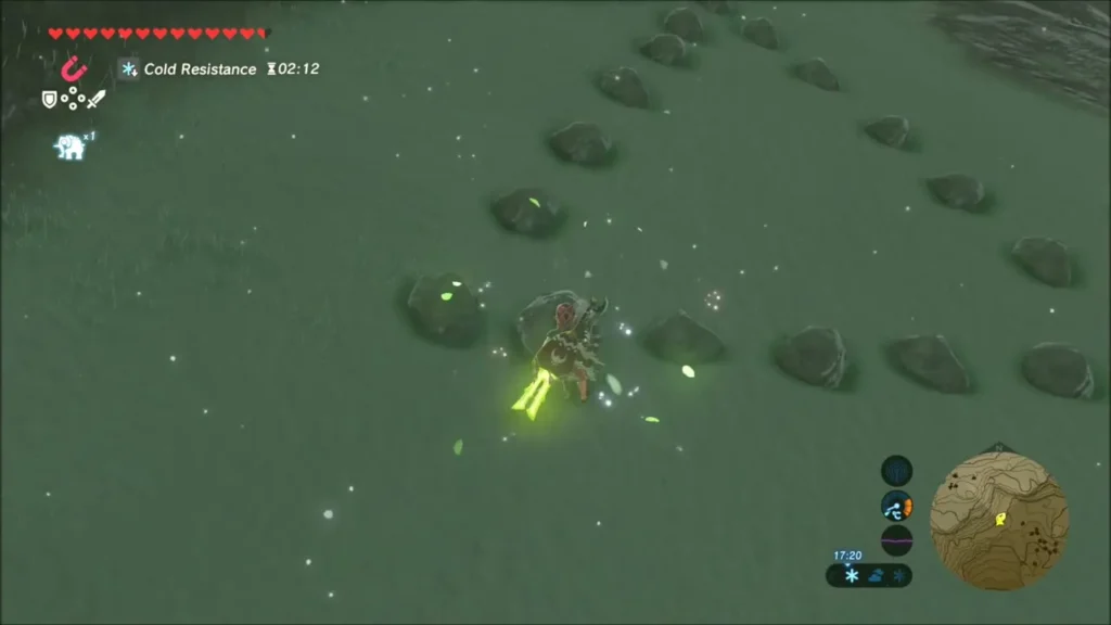 Link placing the rock into the gap of the ring as sparkles appear Link placing the rock into the gap of the ring as sparkles appear