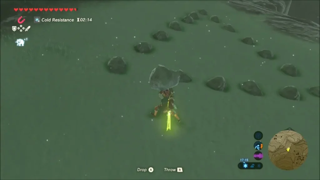 Link holding a rock beside a ring of stones with a gap Link holding a rock beside a ring of stones with a gap