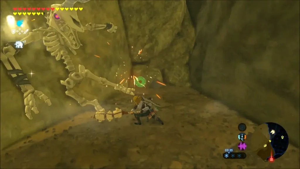 Link fighting a Stalmoblin skeleton inside the narrow cave Link fighting a Stalmoblin skeleton inside the narrow cave