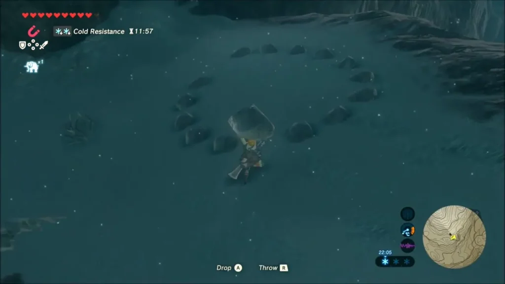 Link carrying a rock toward a ring of stones with a gap on a snowy rise Link carrying a rock toward a ring of stones with a gap on a snowy rise