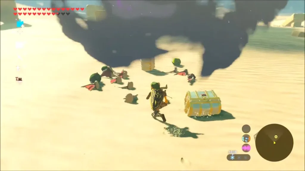 Link beside a golden chest and Molduga parts in the sand after the kill Link beside a golden chest and Molduga parts in the sand after the kill